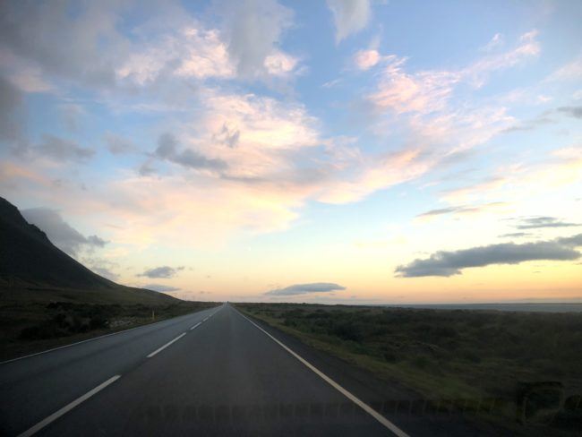 Open road with sun setting